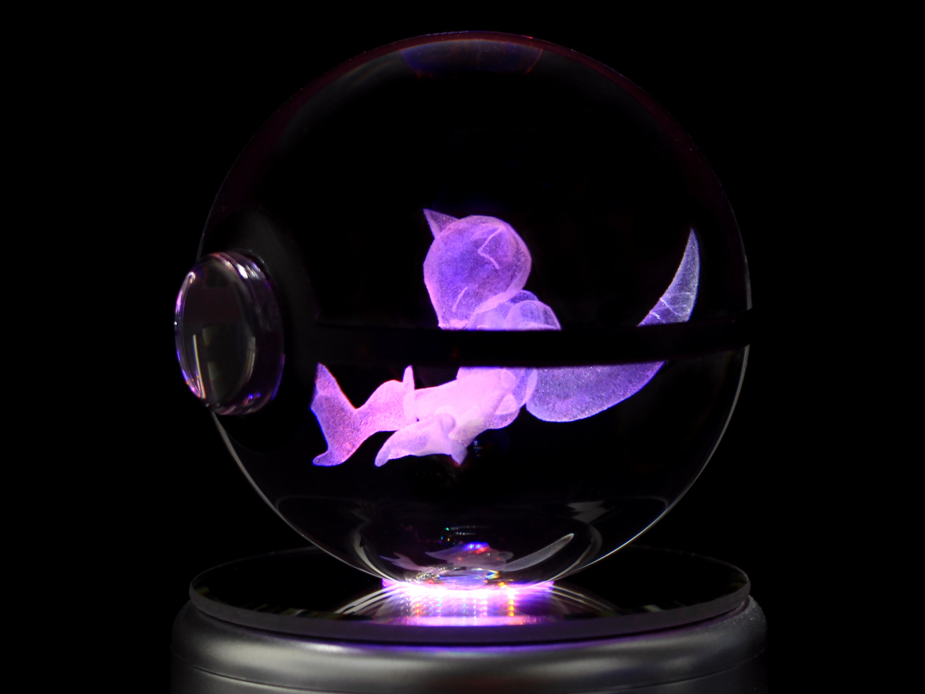 Close up image of Abra Crystal Pokeball on a rotating LED base